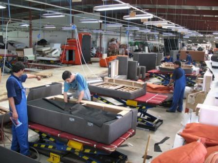 Nepali Uphosleters working at furniture factory in Poland